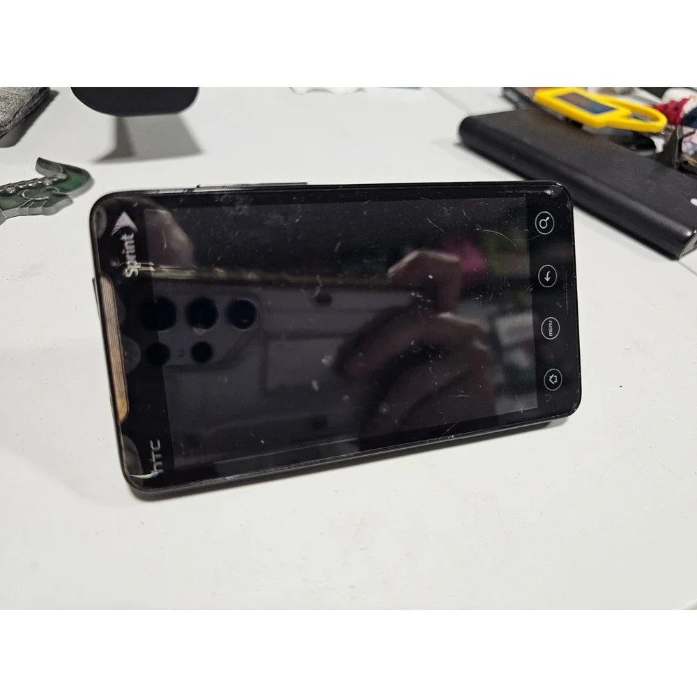 vintage HTC Evo 4G smartphone for the Sprint network stand y2k